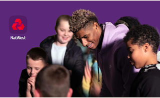 This image shows the footballer and Thrive ambassador Marcus Rashford surrounding by a group of young people.