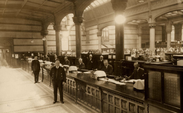Staff at work in the banking hall of Manchester Spring Gardens branch of Manchester & Liverpool District Banking Company in the 1920s © RBS 2019 Staff at work in the banking hall of Manchester Spring Gardens branch of Manchester & Liverpool District Banking Company in the 1920s © RBS 2019