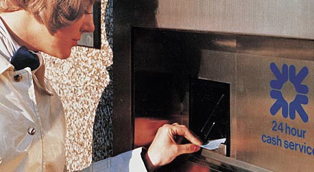 An early Royal Bank cash dispenser in use, 1971