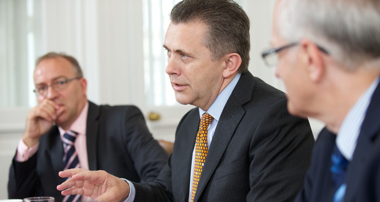 Boardroom discuss progress and challenges