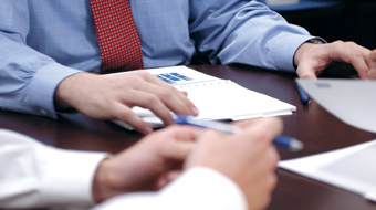 Hands on reports of the boardroom table