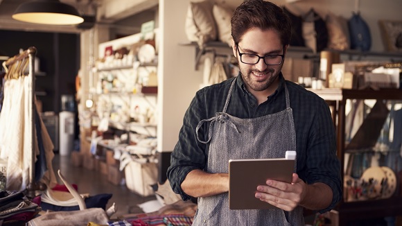 Entrepreneur using RBS mobile banking app on tablet