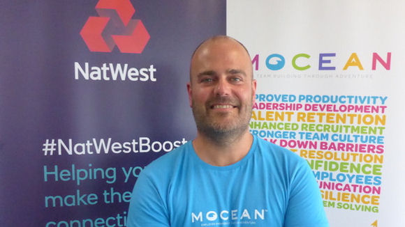 Entrepreneur Mick Lindsay with NatWest and Mocean banners behind him