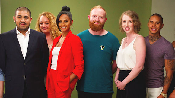 Alesha Dixon standing with a group of successful entrepreneurs