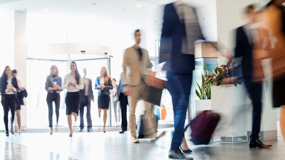 people walking in to an office