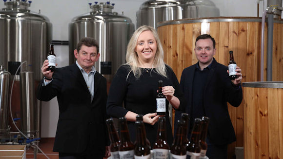 Lynsey Cunningham, Ulster Bank; with Brendan Smyth, left, arc-net; and Liam Brogan, right, Ireland Craft Beers with the new Downstream beer.