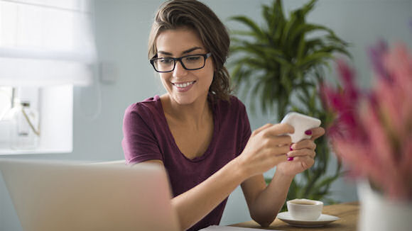 business woman at desk with laptop