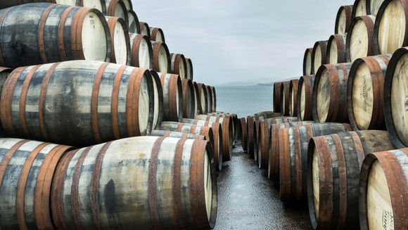 whiskey barrels near the sea